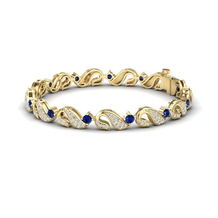 The Blue Sapphire & Diamond Swirl Link Bracelet - Elizabeth features wavy gold links with small white diamonds and round blue sapphires, secured with a sturdy clasp.
