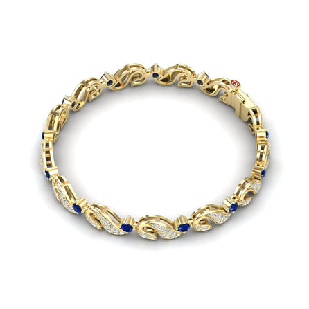 The Blue Sapphire & Diamond Swirl Link Bracelet - Elizabeth features an intricate gold link design with blue sapphires, diamond-encrusted sections, a secure clasp, and a polished finish.