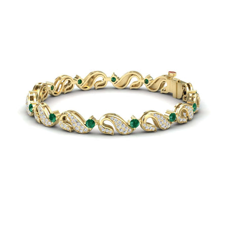The Emerald & Diamond Swirl Link Bracelet - Elizabeth features an intricate vine-like design, sparkling diamonds, and small green gemstones woven throughout its elegant gold pattern.