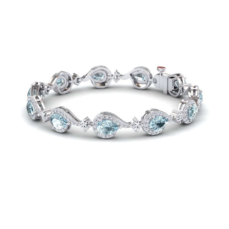 The Aquamarine & Diamond Tennis Bracelet - Gemma features alternating pear-shaped and round light blue aquamarines, each encircled by sparkling diamonds, all set in silver with a secure clasp.