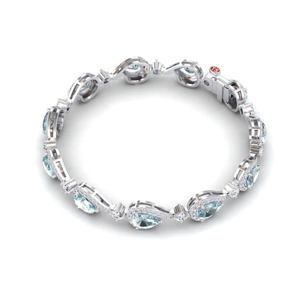 The Aquamarine & Diamond Tennis Bracelet - Gemma features oval-shaped aquamarines surrounded by sparkling diamonds in a repeating silver setting, displayed on a white background.