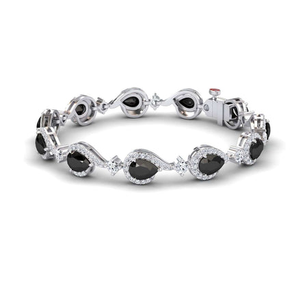 The Black & White Diamond Tennis Bracelet - Gemma features oval black gemstones framed by clear stones in a wavy, elegant pattern, with a secure clasp and sophisticated polished design.