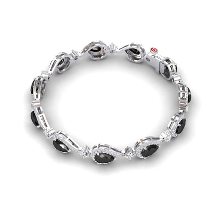 The Black & White Diamond Tennis Bracelet - Gemma features alternating black oval and round clear stones in an intricate silver linked design with a secure clasp.