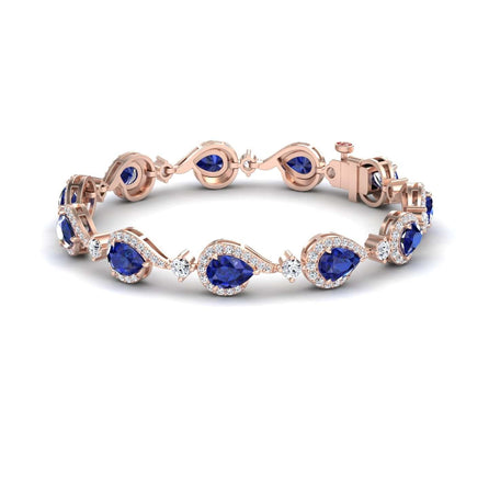 The Blue Sapphire & Diamond Tennis Bracelet - Gemma features teardrop-shaped blue sapphires encircled by sparkling diamonds, linked in an elegant rose gold design with a secure clasp.