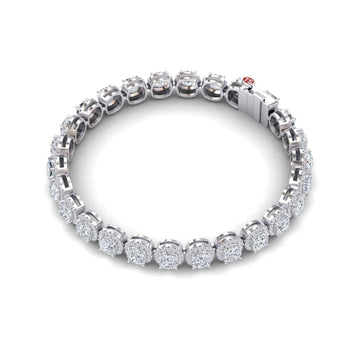 The Lab Grown Diamond Halo Tennis Bracelet - Isabella features round, cluster-set diamonds in individual white gold links, displayed in a circular shape on a white background.