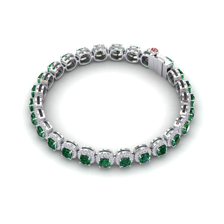 The Isabella Lab Grown Emerald & Diamond Halo Tennis Bracelet features alternating round green emeralds and clear diamonds set in a continuous silver band with a secure clasp.