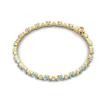The Aquamarine & Diamond Tennis Bracelet - Natalia features evenly spaced round aquamarine gemstones set in prongs, accented with diamonds, and secured with a clasp.