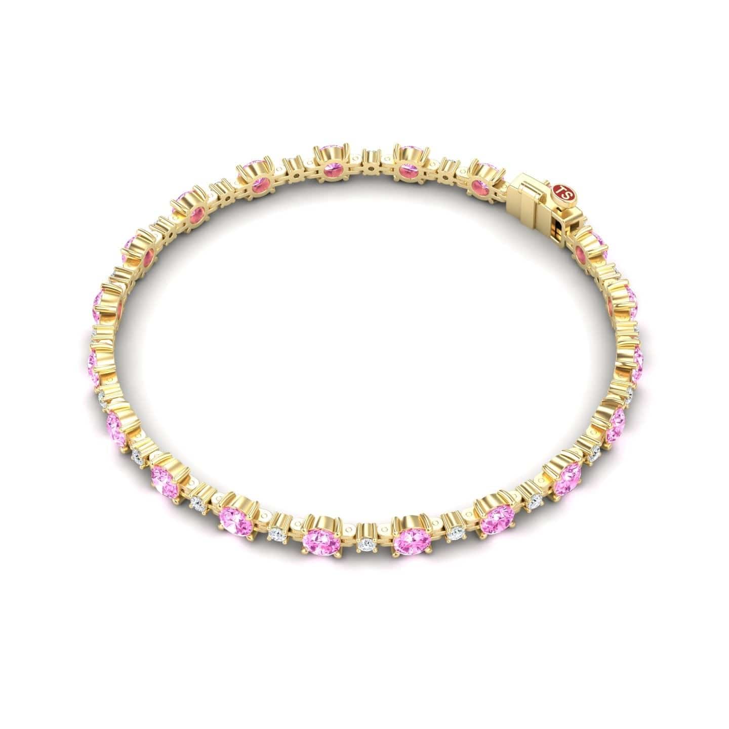 The Pink Sapphire & Diamond Tennis Bracelet - Natalia features round pink sapphires encircled by diamonds, spaced evenly in a continuous loop with a secure clasp.