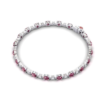 The Pink Tourmaline & Diamond Tennis Bracelet - Natalia showcases alternating round pink tourmalines and clear baguette-cut diamonds in a continuous, elegant circle with a secure clasp.
