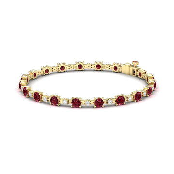 The Ruby & Diamond Tennis Bracelet - Natalia features round red gemstones set evenly along a gold band with a secure clasp.