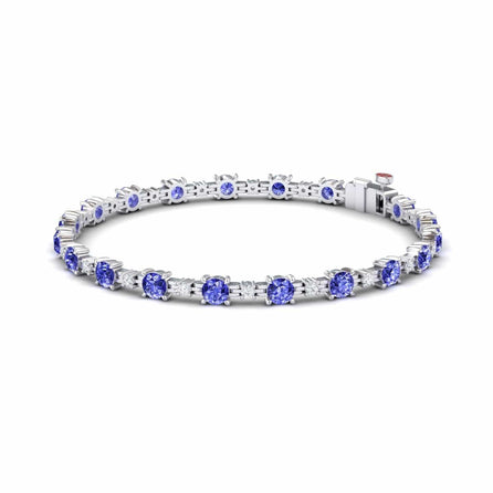 The Tanzanite & Diamond Tennis Bracelet - Natalia is a silver bracelet with evenly spaced round violet-blue tanzanite gemstones in prong settings, shown on a white background.