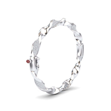 The White Diamond Twisted Bangle Bracelet - Dakota features alternating smooth and textured sparkling segments with a small red TS tag near the clasp.