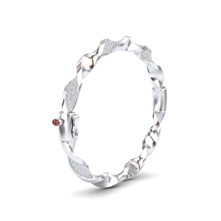 The White Diamond Twisted Bangle Bracelet - Dakota features alternating smooth and textured sparkling segments with a small red TS tag near the clasp.