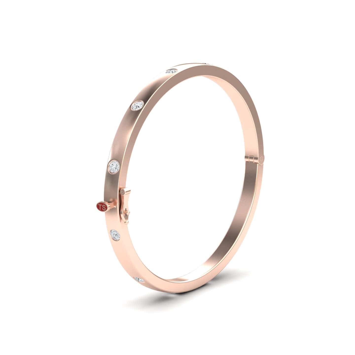 The Diamond Bezel-Set Bracelet - Flavia features a rose gold bangle with evenly spaced round white gemstones and a small red circular accent near the clasp, elegantly displayed on a white background.