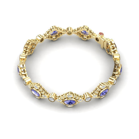 The Tanzanite & Diamond Vintage-Inspired Tennis Bracelet – Ariana showcases intricate links with oval blue tanzanites and round white diamonds in an elegant, repeating pattern against a white background.