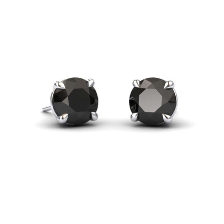The Black Diamond Stud Earrings - Gauri feature round black gemstones set in sleek silver prongs, shown on a white background.