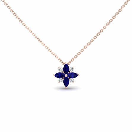The Blue Sapphire & Diamond Flower Necklace - Keira is a gold chain necklace with a flower pendant featuring four marquise blue sapphires and four small round diamonds arranged alternately.