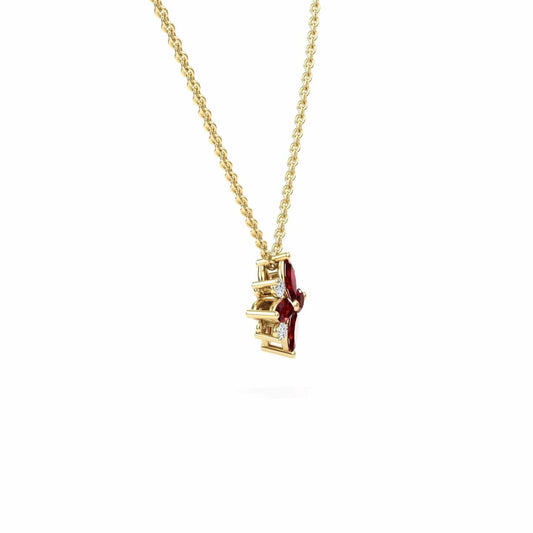 The Ruby & Diamond Flower Necklace - Keira features a gold chain with a pendant showcasing vertically arranged red and clear gemstones, set in gold, photographed on a white background.