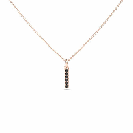 The Black Diamond Vertical Bar Necklace - Lalita features a delicate rose gold chain and a slim vertical bar pendant adorned with small black stones, shown on a white background.
