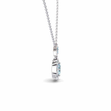 The Aquamarine & Diamond Geometric Halo Necklace - Reema features a thin silver chain and an oval blue gemstone pendant, shown from the side against a white background.