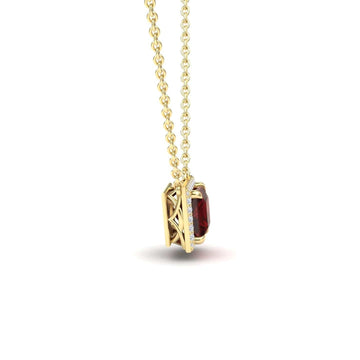 The Garnet & Diamond Halo Necklace - Gabriella features a gold chain and a rectangular red garnet pendant in a decorative gold setting, shown from the side against a white background.