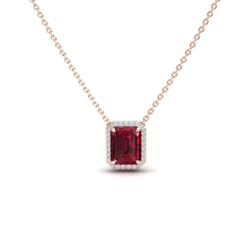 The Ruby & Diamond Halo Necklace - Hilary is a gold chain necklace with a rectangular red gemstone pendant encircled by small white diamonds, shown against a white background.