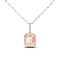 The Morganite & Diamond Halo Necklace - Sanya features a rectangular emerald-cut light pink morganite pendant, surrounded by sparkling diamonds and set on a delicate rose gold chain.