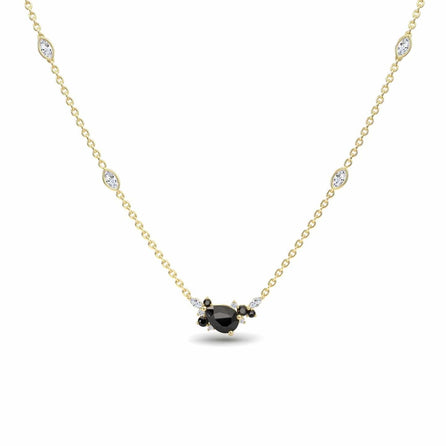 The Black & White Diamond Bouquet Necklace - Daria showcases a delicate gold chain with a central black gemstone encircled by white and black stones, plus four evenly spaced white stones along the chain.
