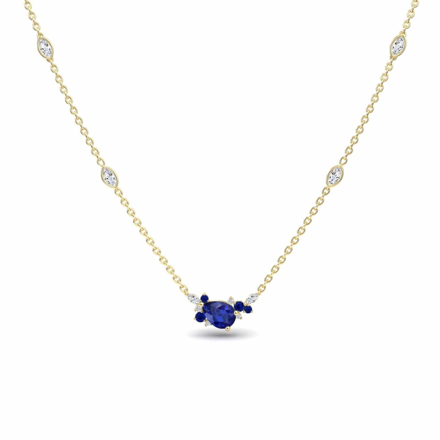 The Blue Sapphire & Diamond Bouquet Necklace - Daria features a central oval blue sapphire flanked by smaller sapphires and diamonds, with additional small diamonds set along its elegant gold chain.