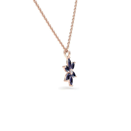 The Lab Grown Alexandrite & Diamond Floral Necklace - Erin features a flower-shaped rose gold pendant with six dark blue marquise gemstones, shown against a white background.