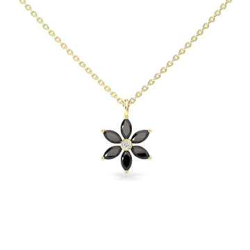The Black Diamond & Diamond Floral Necklace - Erin features a gold chain with a flower-shaped pendant, six black stones as petals, and a central clear stone.