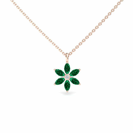 The Lab Grown Emerald & Diamond Floral Necklace - Erin features a gold chain with a flower pendant showcasing six marquise-cut green emeralds as petals and a round white diamond at the center.