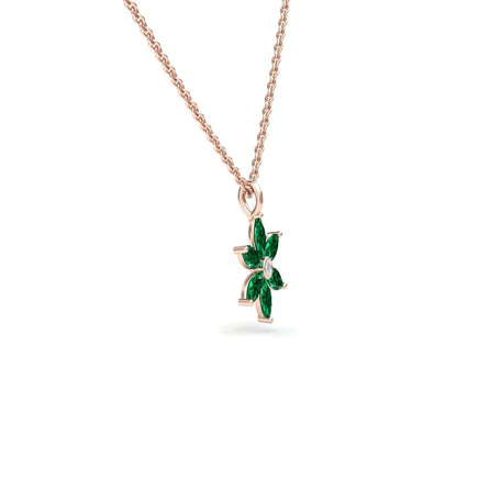 The Lab Grown Emerald & Diamond Floral Necklace - Erin features a rose gold chain with a floral pendant set with six marquise-cut green lab-grown emeralds and a central diamond, shown against a white background.