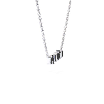 The Black & White Diamond Geometric Bar Necklace - Fernanda features a silver chain with small rectangular black and silver pendants evenly spaced along the center, set against a plain white background.