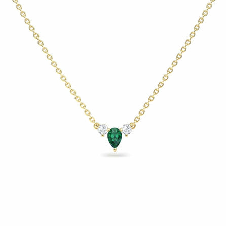The Emerald & Diamond Three-Stone Necklace - Jina features a gold chain with a pear-shaped green gemstone pendant accented by two small round white gemstones on each side, shown against a white background.
