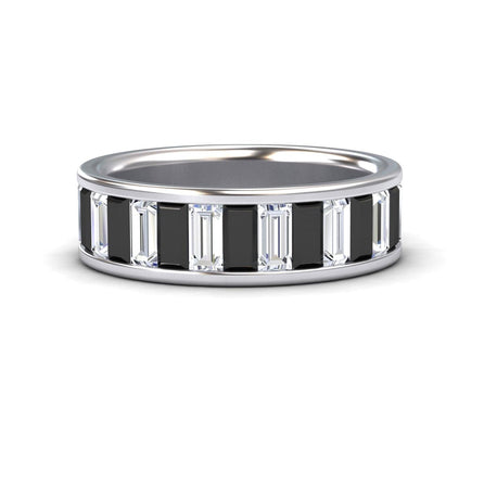 The Kyra Black & White Diamond Channel-Set Eternity Band is a silver ring with alternating rectangular black and clear baguette-cut stones in a continuous pattern around the band.