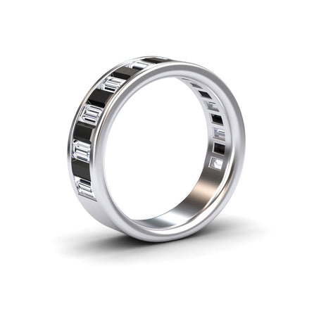 The Black & White Diamond Channel-Set Eternity Band - Kyra features rectangular diamonds set in a continuous channel around the silver band, shown against a white background.