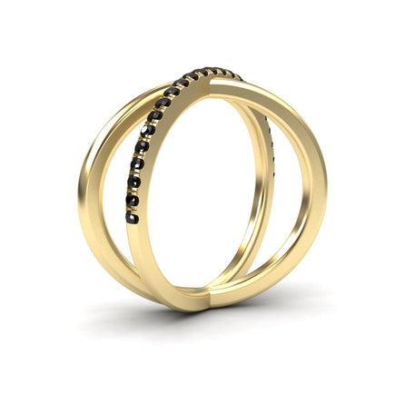 The Trisha Black Diamond Criss-Cross Pave Band Ring features two parallel gold bands joined at the base, with one band accented by a row of black diamonds. Its modern, elegant design stands out against a white background.