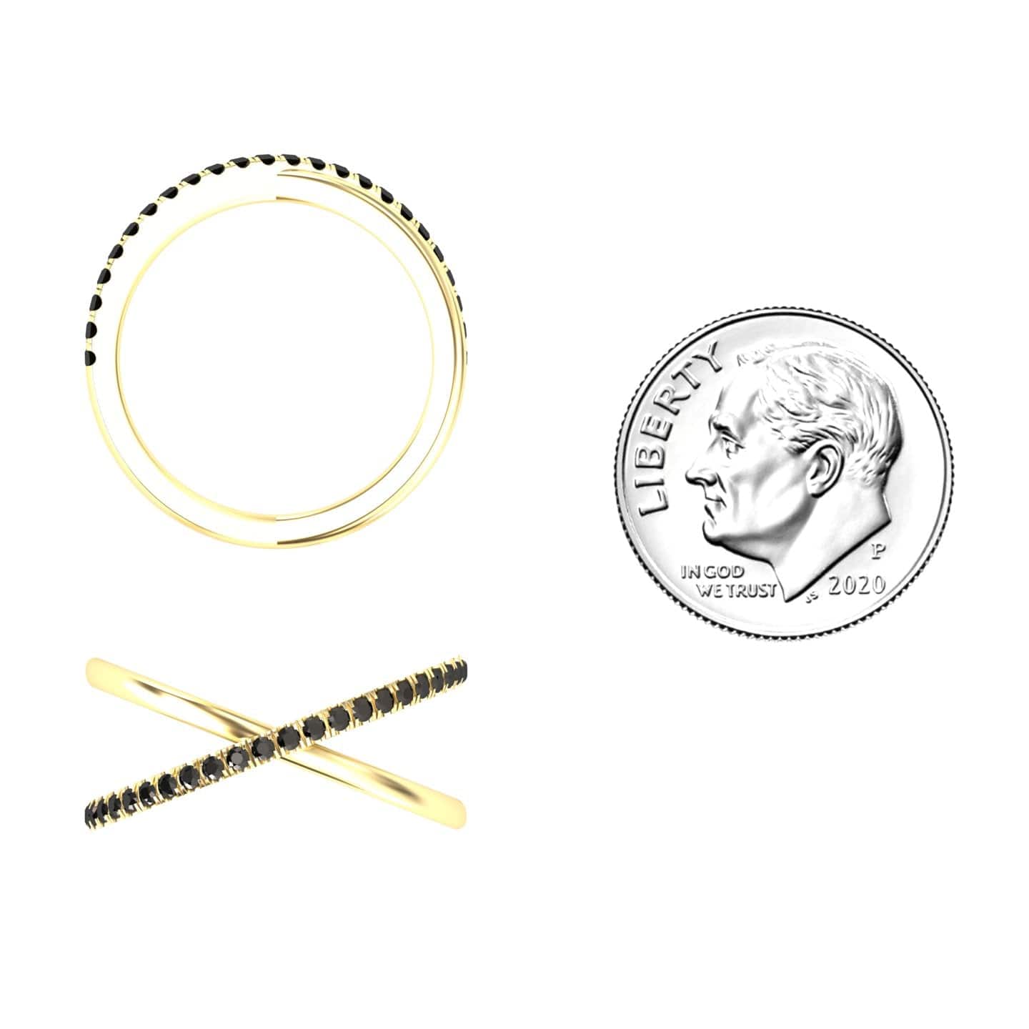 The Black Diamond Criss-Cross Pave Band Ring - Trisha, a thin gold ring with black stones in an “X” shape, is shown beside a 2020 U.S. dime for size comparison on a white background.