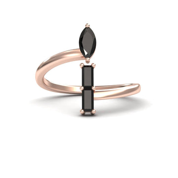The Statement Shimmer: Black diamonds Mesmerizing Magic - MYSR18 is a rose gold open band ring with a marquise-cut black gemstone on one end and two vertical rectangular black stones on the other, displayed on a white background.