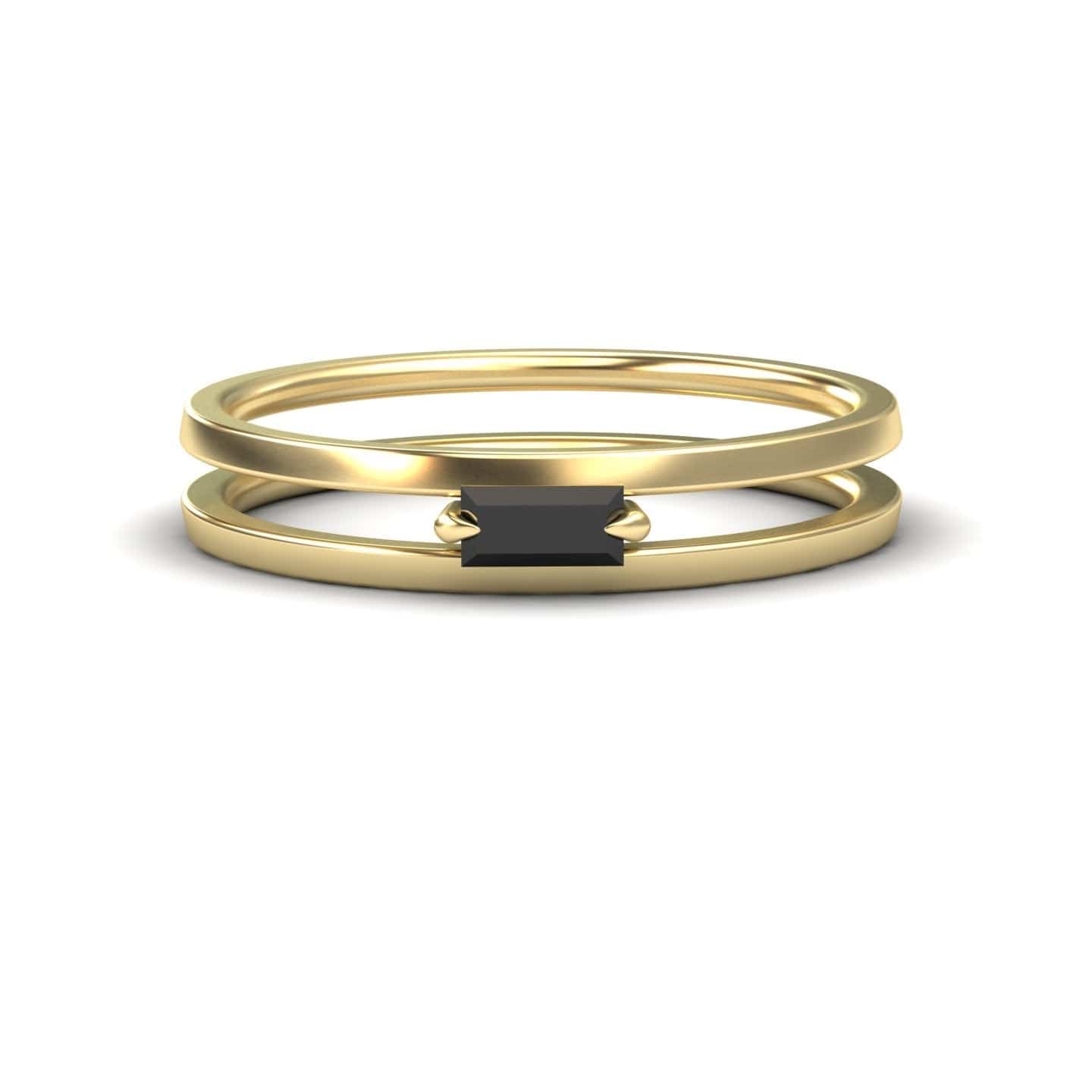 The Black Diamond Minimalist Double Band Ring - Alia showcases a rectangular black gemstone set horizontally on a slim, double gold band, displayed against a white background.