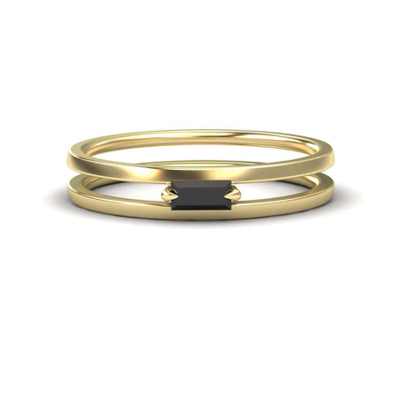 The Black Diamond Minimalist Double Band Ring - Alia showcases a rectangular black gemstone set horizontally on a slim, double gold band, displayed against a white background.