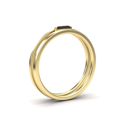 The Alia Black Diamond Minimalist Double Band Ring features a slim gold band with a small rectangular black diamond, showcased on a plain white background.