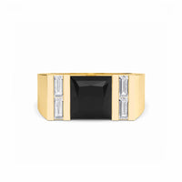 The Casper Black & White Diamond Mens Statement Ring has a large square black gemstone center, with two vertical rows of rectangular white diamonds on each side, shown against a white background.