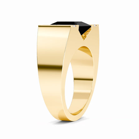 The Casper Black & White Diamond Mens Statement Ring features a wide gold band and a bold rectangular black gemstone in a geometric prong setting, displayed against a white background.