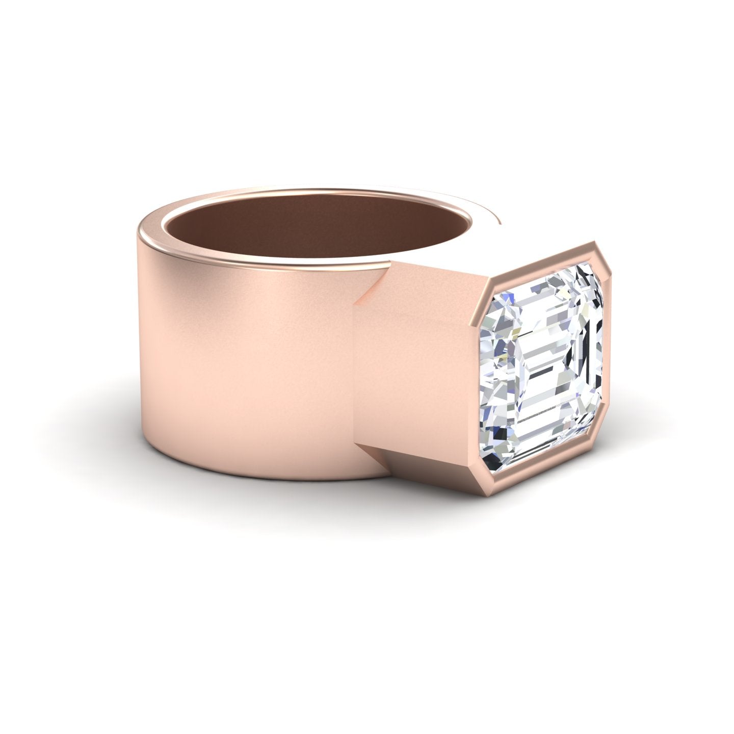 The Moissanite Statement Ring - Aparna features a wide rose gold band with a matte finish and a large emerald-cut moissanite set horizontally in a modern bezel, creating a bold and contemporary look.