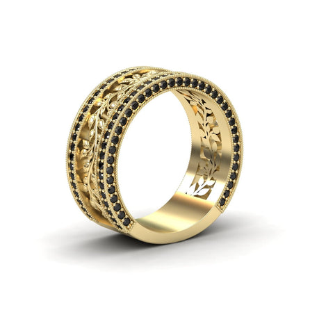 The Casey Black Diamond Vine Motif Eternity Band features an intricate leaf pattern with two rows of small black diamonds, plus additional leaf engravings on the inner band.