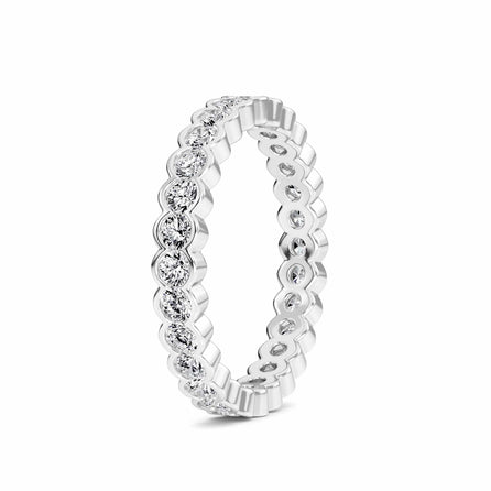 white gold ring with diamond accents on a white background