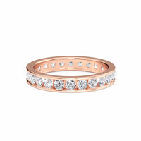 Rose gold ring with diamonds on a white background