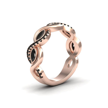 The Black Diamond Infinity Twist Band - Selma showcases a rose gold infinity loop, accented with small black diamonds and marquise shapes for a chic, modern style.